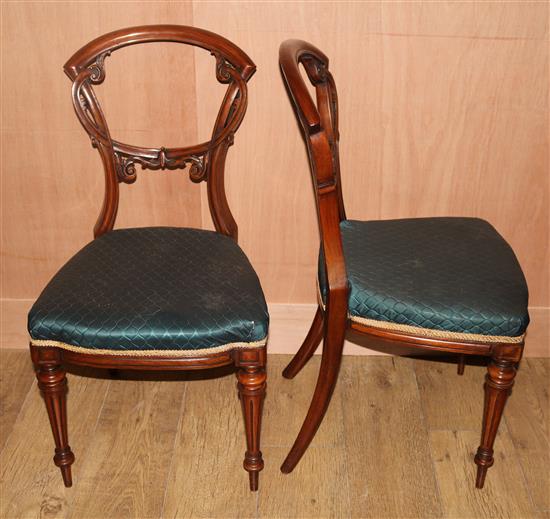 A set of six Victorian walnut balloon back dining chairs
